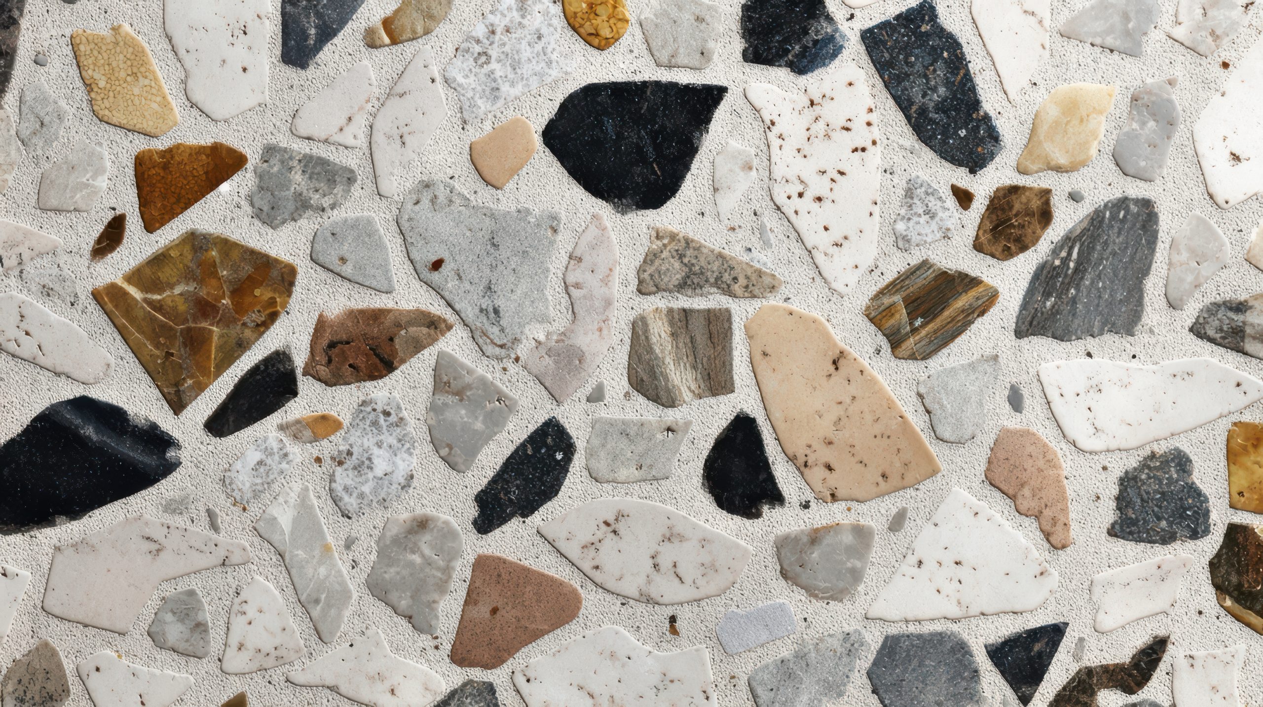 colorful terrazzo surface with irregular stone fragments scaled